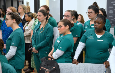 A group of people in Nursing scrubs