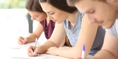 Three Students Writing