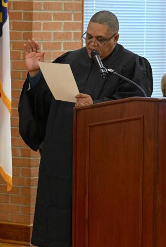 Magistrate Jeffers stands at the podium while he swears in the graduates.
