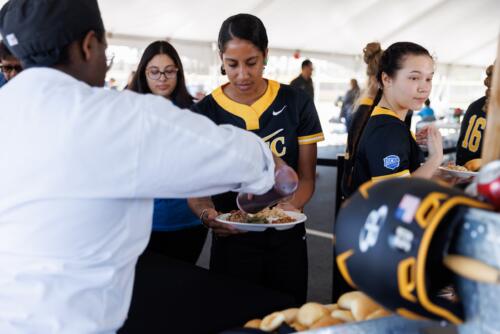 FTCC softball players go through the buffet line before the game.