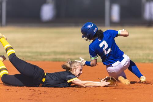 The FTCC shortstop dives to tag a runner at second base.