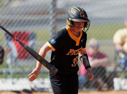 A FTCC batter tosses the bat while running to first base.