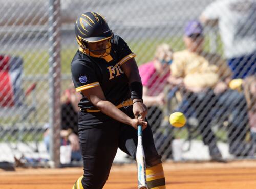 A FTCC batter hits the ball.