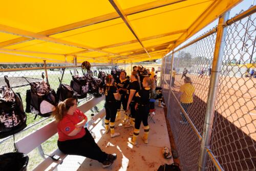 A photo of the FTCC softball team inside the dugout.