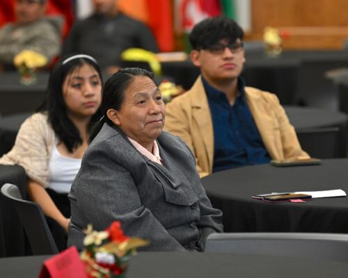 Family members of graduates sit at the graduation for the Spanish Language Electrical Program.